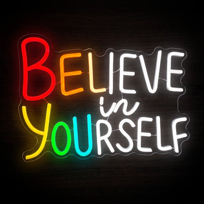Believe in Yourself LED neon sign featuring colorful rainbow lettering and bright white motivational text.