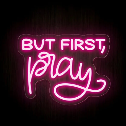 But First, Pray LED neon sign on precision-cut acrylic backing with bright pink illumination for Christian wall decor.