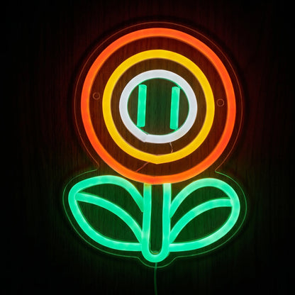 Cartoon Flower LED Neon Sign featuring orange, yellow and white circular petals with a green stem and leaves.