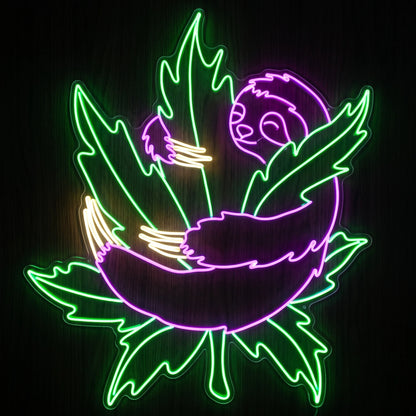 Chill Sloth Cannabis LED neon sign featuring a relaxed purple sloth hugging a glowing green cannabis leaf on a precision-cut clear acrylic backing.