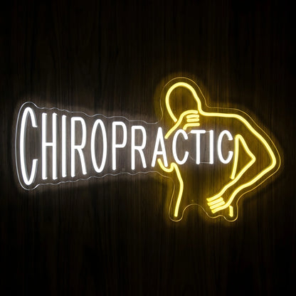 Chiropractic Back Pain LED neon sign featuring cool white CHIROPRACTIC lettering and a yellow outline of a person holding their lower back on clear acrylic backing for chiropractic office wall decor.