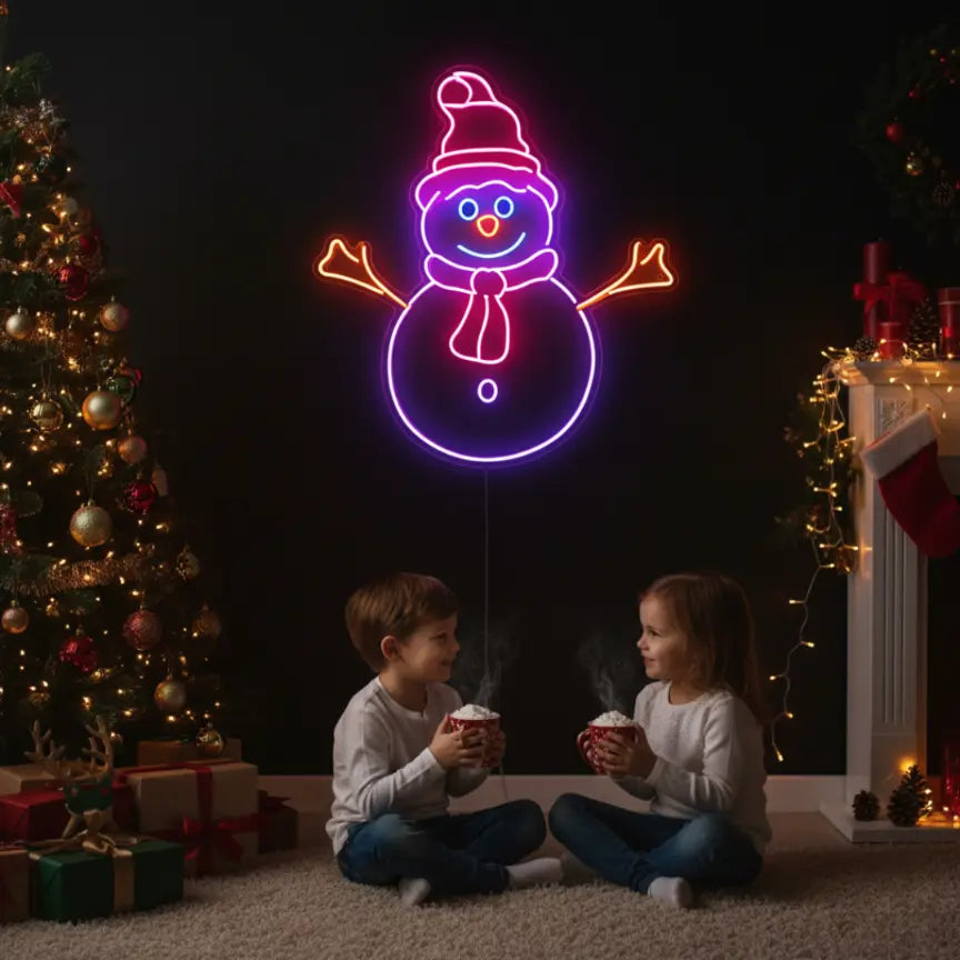 Photo of the 'Christmas Snowman' neon sign glowing in multicolor against a styled interior wall.