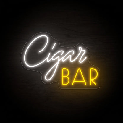 Cigar Bar LED neon sign on clear acrylic backing with white script lettering and warm golden block text for cigar lounge wall décor.