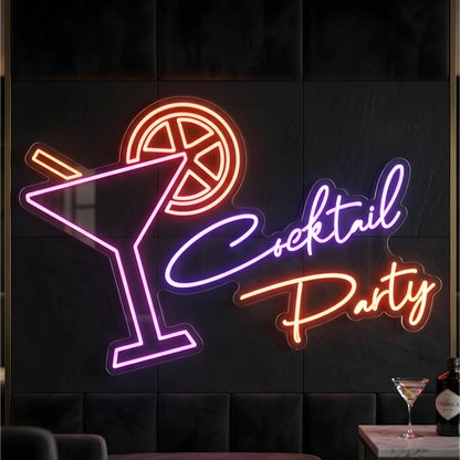 Photo of the 'Cocktail Party' neon sign glowing in multi-color against a styled interior wall.