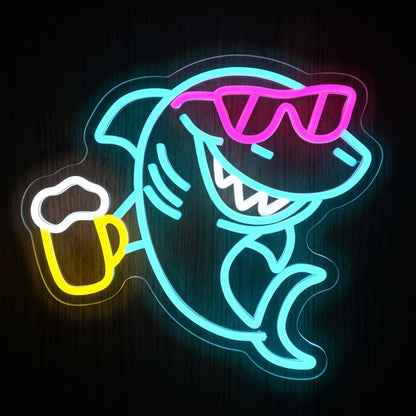 Cool Shark Beer LED neon sign featuring a blue shark wearing pink sunglasses and holding a yellow beer mug on clear acrylic.