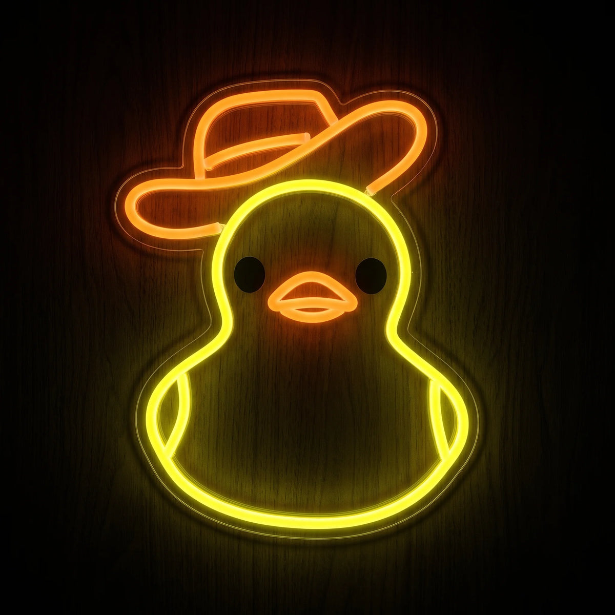 Cowboy duck LED neon sign with yellow duck outline, orange beak and cowboy hat on acrylic backing.
