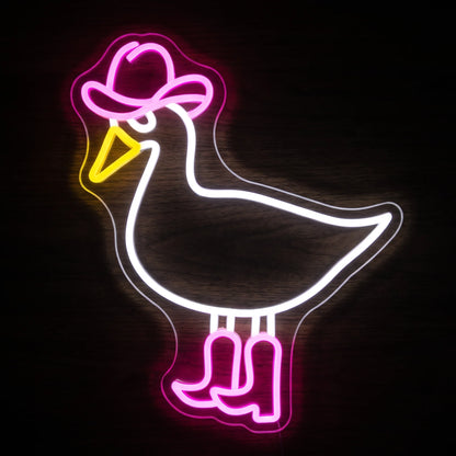 Cowboy goose LED neon sign with white goose outline, pink cowboy hat and boots, yellow beak, and clear acrylic backing.
