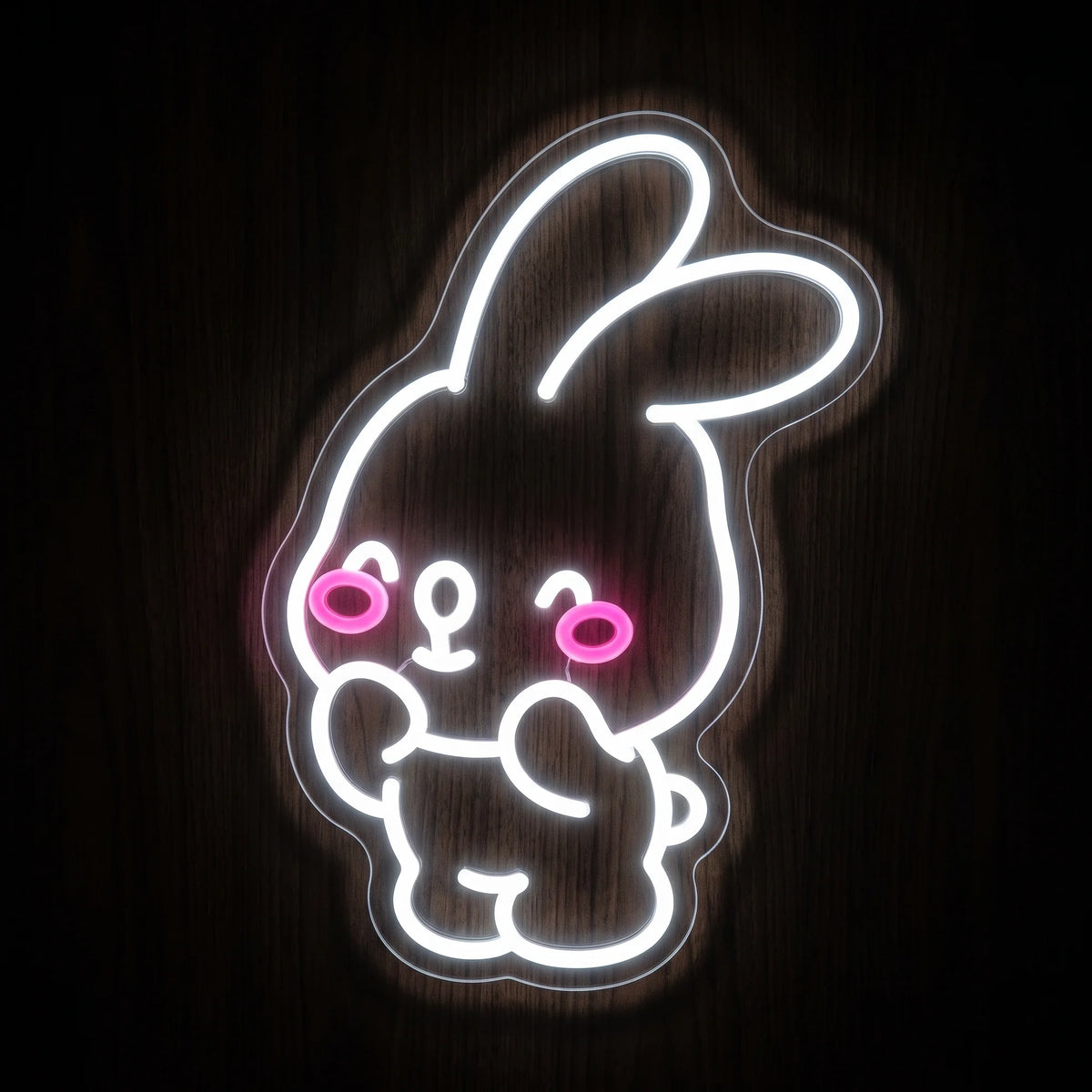 Cute bunny LED neon sign with bright white outline, pink cheeks, and clear acrylic backing.

