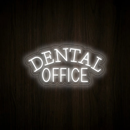 Classic Dental Office LED neon sign featuring cool white arched DENTAL lettering above OFFICE text on precision-cut clear acrylic backing, displayed on a dark wooden wall for dentist office decor.