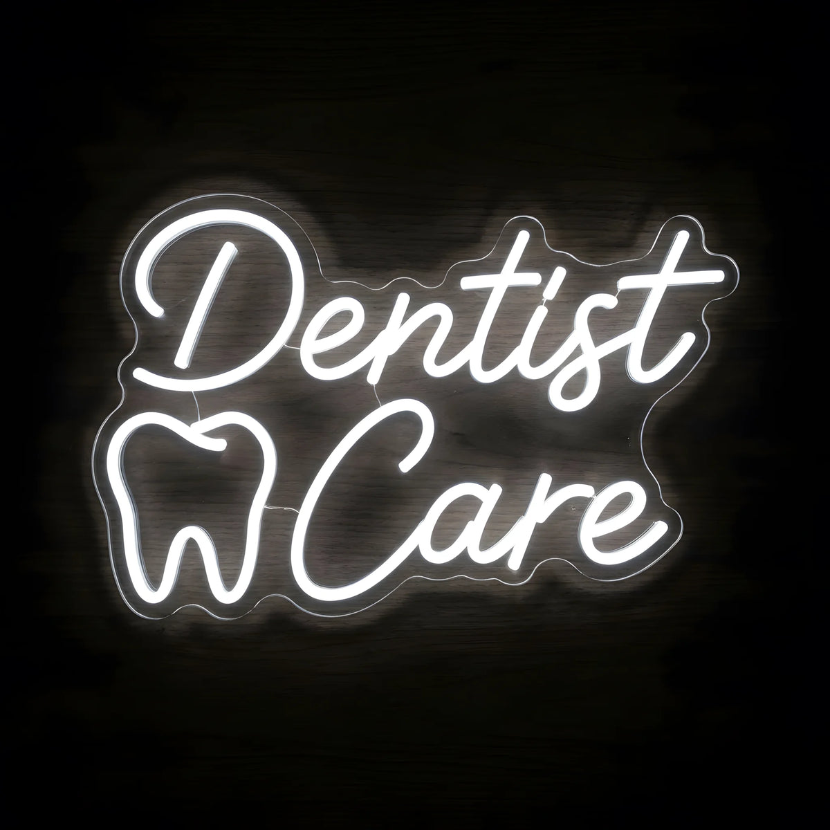 Dentist Care Script LED neon sign featuring elegant cool white Dentist Care cursive lettering and an illuminated tooth outline on clear acrylic backing for dental clinic wall decor.