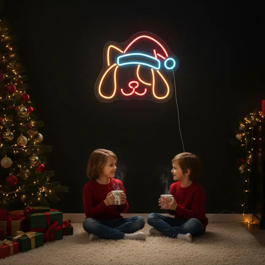 Photo of the 'Dog In Santa Hat' neon sign glowing in multicolor against a styled interior wall.