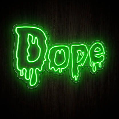 Dripping Dope Script LED neon sign featuring bright green melting graffiti-style lettering on a clear acrylic backing.