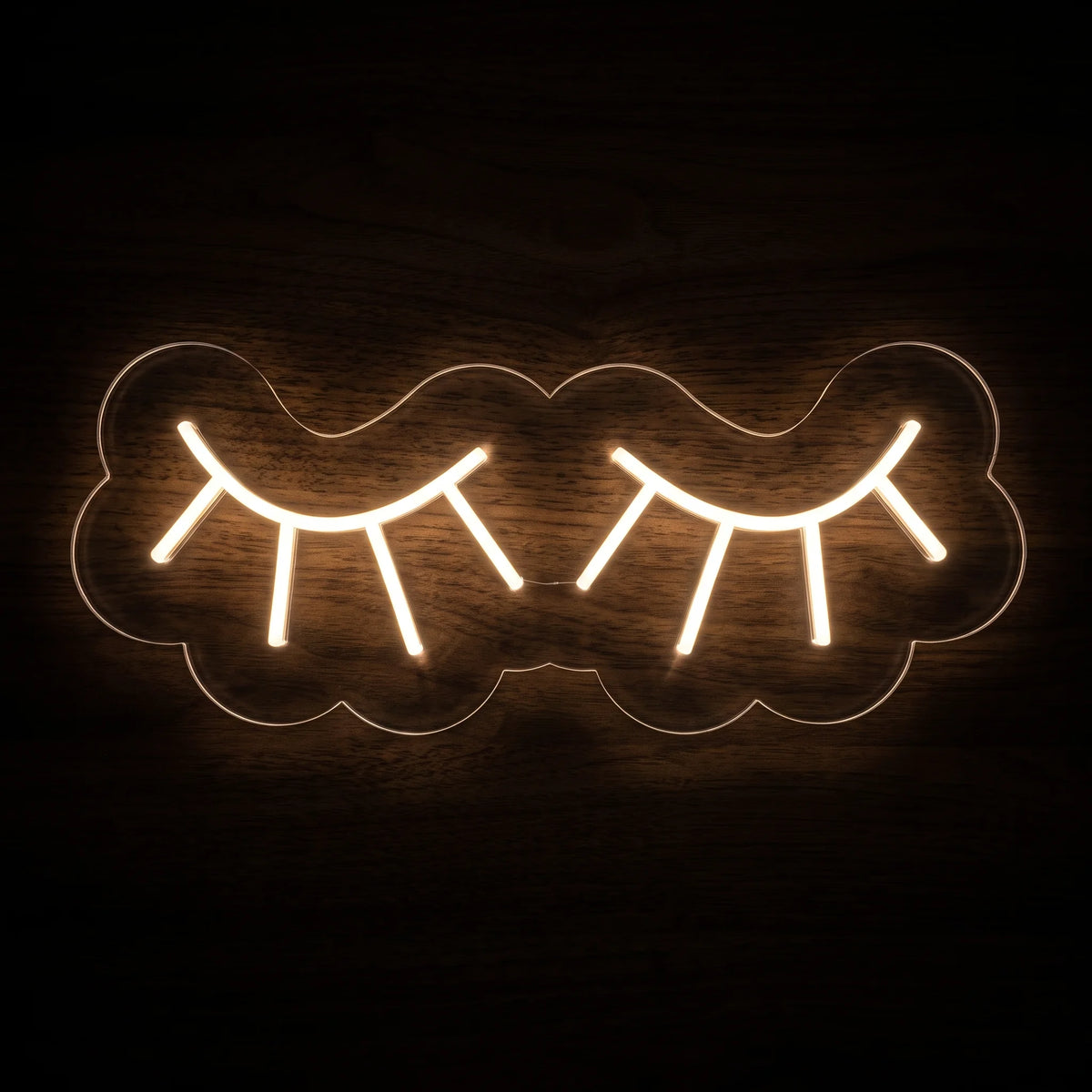 Eye Lashes LED Neon Sign featuring warm white closed eyes and eyelash outlines on a clear acrylic backing.