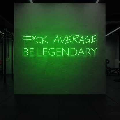  'F*ck Average Be Legendary' neon sign glowing in green against a styled interior wall.