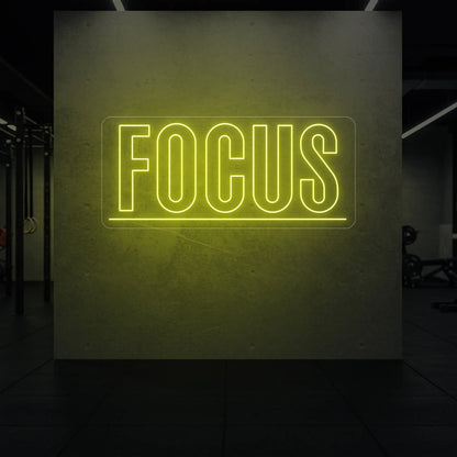  'Fortune Favours the Brave' neon sign glowing in golden yellow against a styled interior wall.