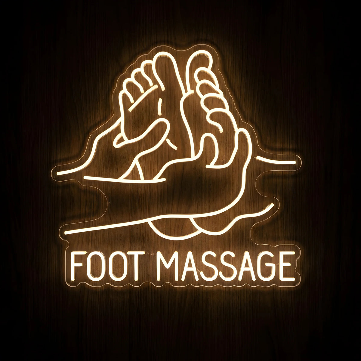 Foot Massage Hands LED Neon Sign featuring warm white illuminated outlines of hands massaging feet with FOOT MASSAGE lettering on clear acrylic against a dark wooden wall.