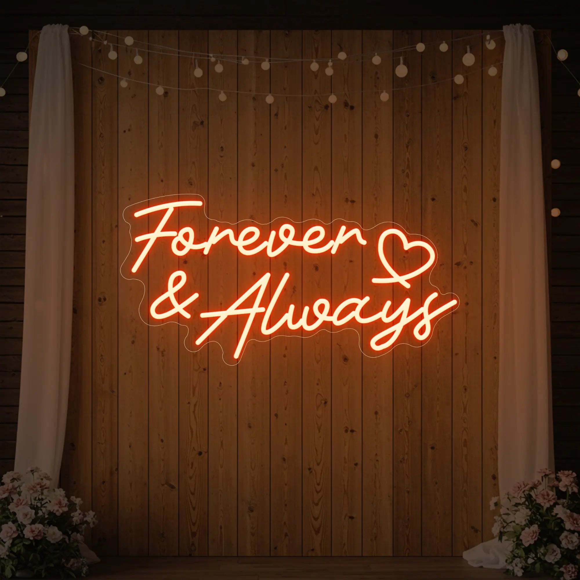Photo of the 'Forever & Always' neon sign glowing in golden yellow against a styled interior wall.