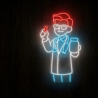 Friendly Doctor Character LED Neon Sign featuring a smiling cartoon doctor with red hair, glasses, white lab coat, blue stethoscope, red capsule, and medical jar on clear acrylic backing against a dark wooden wall.