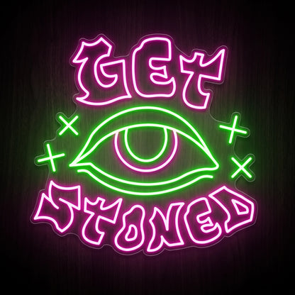 Get Stoned Eye LED neon sign with pink lettering, green eye graphic, and clear acrylic backing for recreational wall décor.