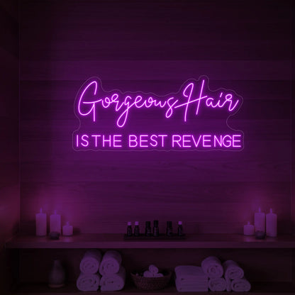 Photo of the 'Gorgeous Hair is the Best Revenge' neon sign glowing in deep pink against a styled interior wall.