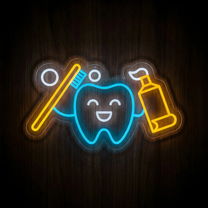 Happy Tooth Dental Tools LED neon sign featuring a smiling cyan-blue tooth holding a golden-yellow toothbrush and toothpaste tube with cool white facial accents on clear acrylic backing for dental clinic decor.
