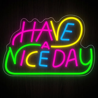 Have a Nice Day LED Neon Sign with colorful pink, yellow, blue and green lettering on a clear acrylic backing.