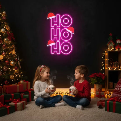 Photo of the 'Ho Ho Ho V3' neon sign glowing in multicolor against a styled interior wall.