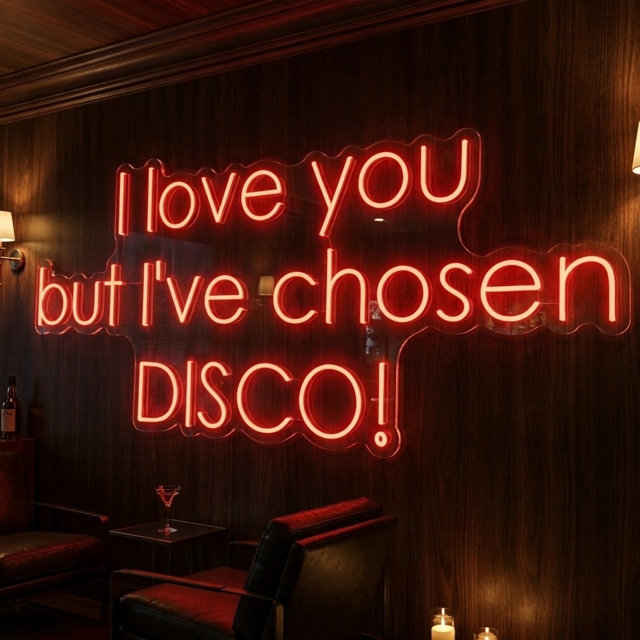 Photo of the 'I Love You But I’ve Chosen Disco' neon sign glowing in red against a styled interior wall.