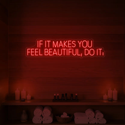 Photo of the 'IF IT MAKES YOU FEEL BEAUTIFUL, DO IT.' neon sign glowing in red against a styled interior wall.