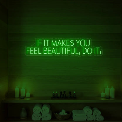 Photo of the 'IF IT MAKES YOU FEEL BEAUTIFUL, DO IT.' neon sign glowing in green against a styled interior wall.