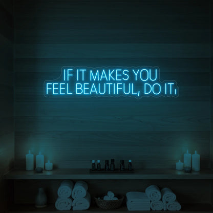 Photo of the 'IF IT MAKES YOU FEEL BEAUTIFUL, DO IT.' neon sign glowing in ice blue against a styled interior wall.