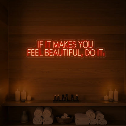 Photo of the 'IF IT MAKES YOU FEEL BEAUTIFUL, DO IT.' neon sign glowing in golden yellow against a styled interior wall.