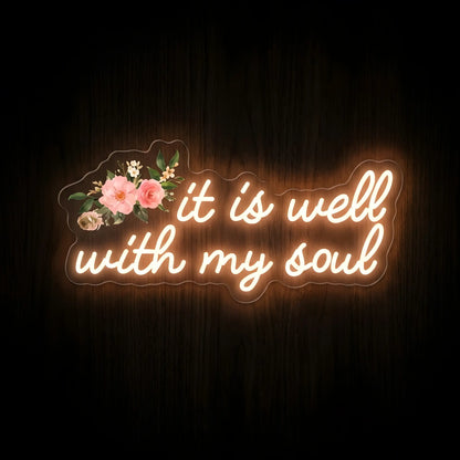 It Is Well with My Soul warm white LED neon sign with printed pink floral artwork on clear acrylic backing for Christian home décor and prayer rooms.