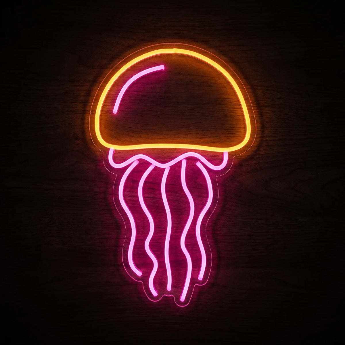 Jellyfish LED neon sign featuring a bright orange dome and flowing pink tentacles on clear acrylic backing.