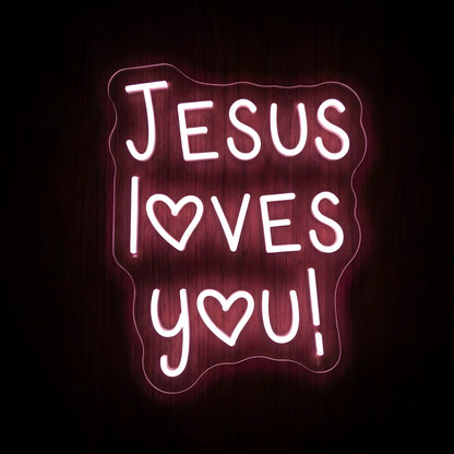 Jesus Loves You LED neon sign featuring pink illuminated lettering with heart-shaped accents on a precision-cut clear acrylic backing for Christian wall decor.