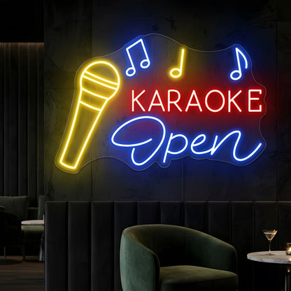 Photo of the 'Karaoke Open' neon sign glowing in multi-color against a styled interior wall.