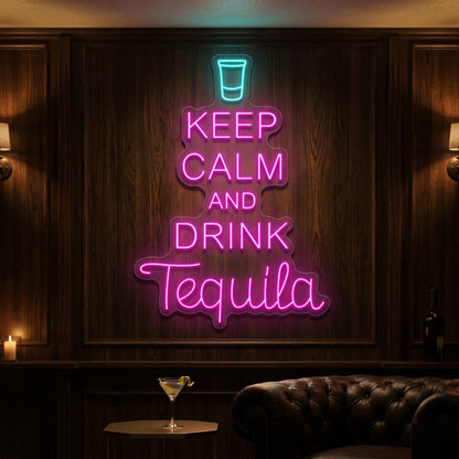 Photo of the 'Keep Calm and Drink Tequila' neon sign glowing in multi-color against a styled interior wall.