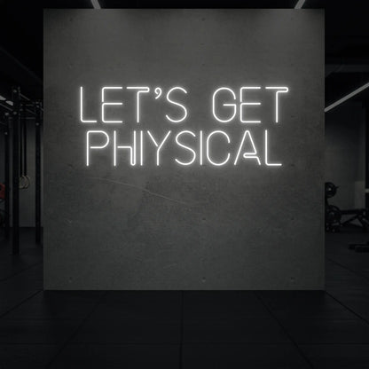  'LET'S GET PHYSICAL' neon sign glowing in cool white against a styled interior wall.