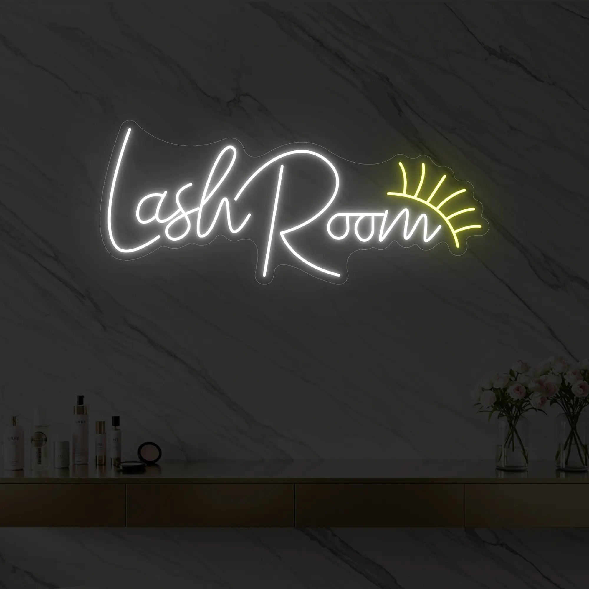 Photo of the 'Lash Room' neon sign with an eyelash icon glowing in cool white against a styled interior wall.