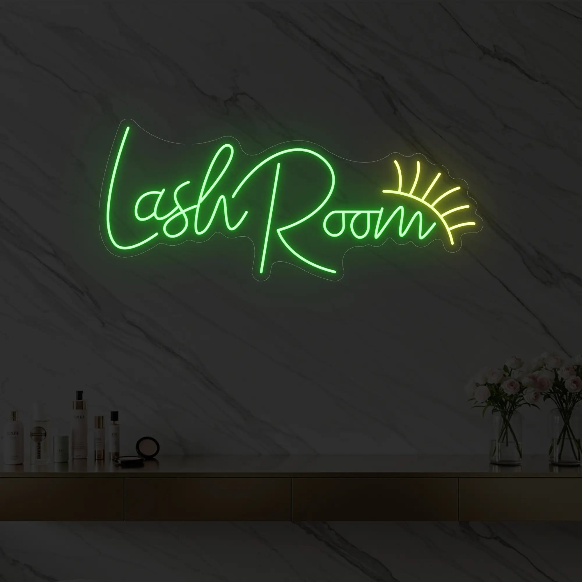 Photo of the 'Lash Room' neon sign with an eyelash icon glowing in green against a styled interior wall.