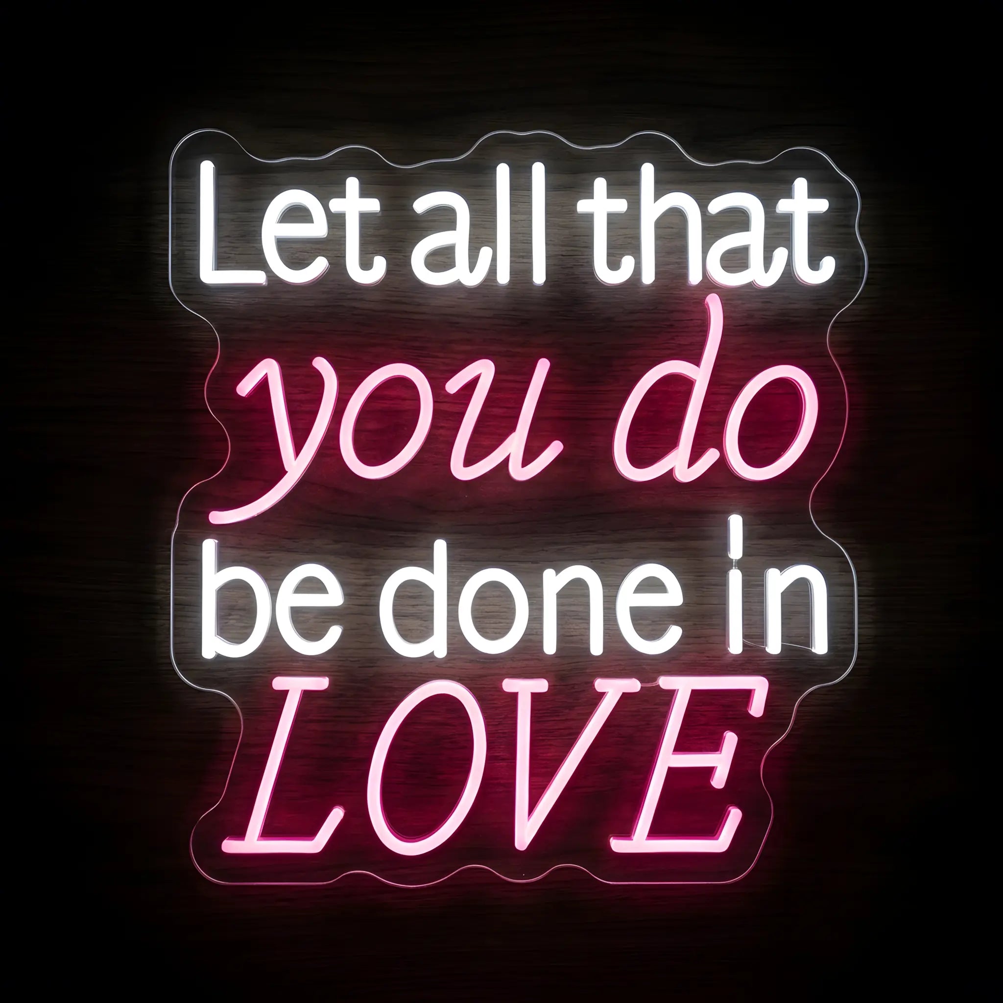 Let All That You Do Be Done in Love LED neon sign featuring white and pink illuminated lettering inspired by 1 Corinthians 16:14 on a precision-cut clear acrylic backing.