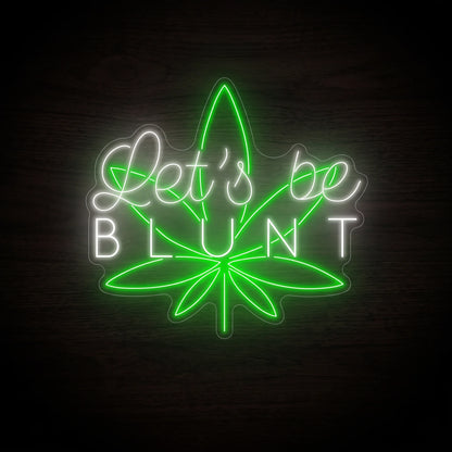 Shop the Let's Be Blunt LED Neon Sign featuring elegant white lettering and a glowing green cannabis leaf. Perfect for dispensaries, smoke shops, lounges, and home bars.