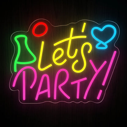 Let's Party LED neon sign with yellow and pink lettering and colorful neon accents on acrylic backing.