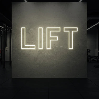  'LIFT' neon sign glowing in warm white against a styled interior wall.