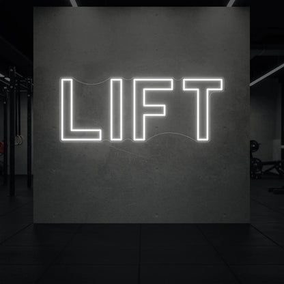 'LIFT' neon sign glowing in cool white against a styled interior wall.