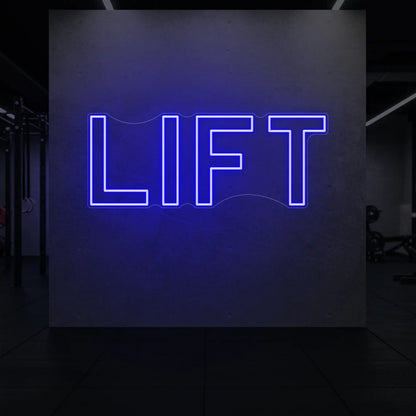 'LIFT' neon sign glowing in deep blue against a styled interior wall.