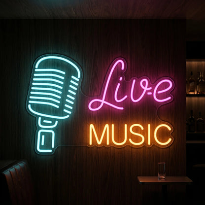 Photo of the 'Live Music' neon sign glowing in multi-color against a styled interior wall.
