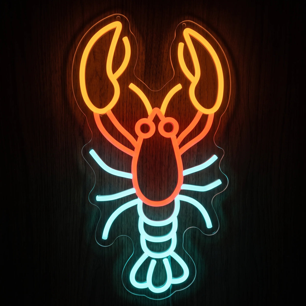 Lobster LED Neon Sign with orange claws, red-orange body and ice blue legs and tail on clear acrylic backing.