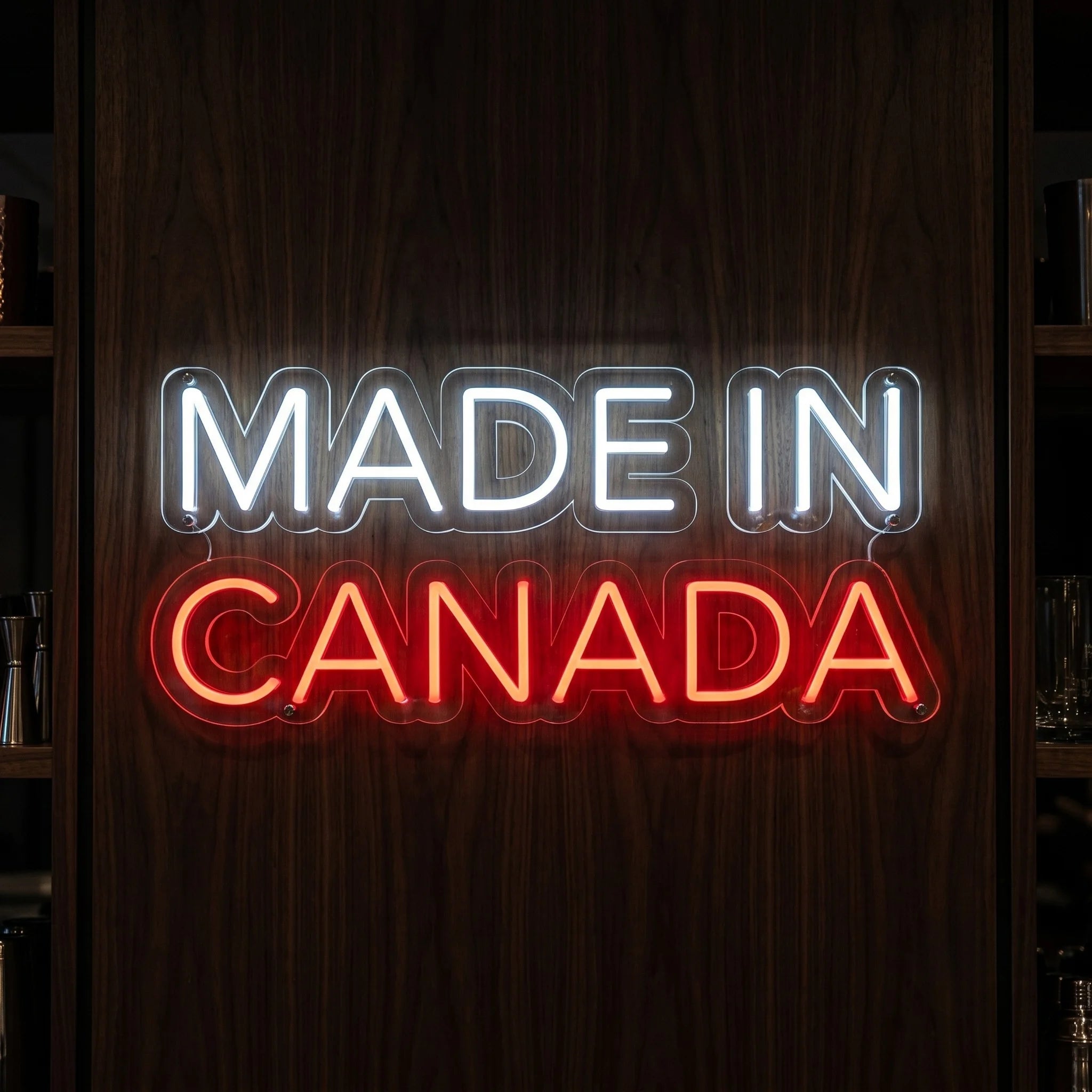 Made In Canada LED neon sign in red and cool white mounted on clear acrylic backing