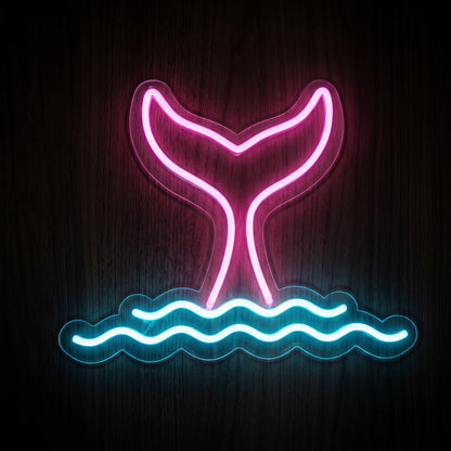 Mermaid tail LED neon sign with bright pink tail and blue ocean waves on clear acrylic backing.